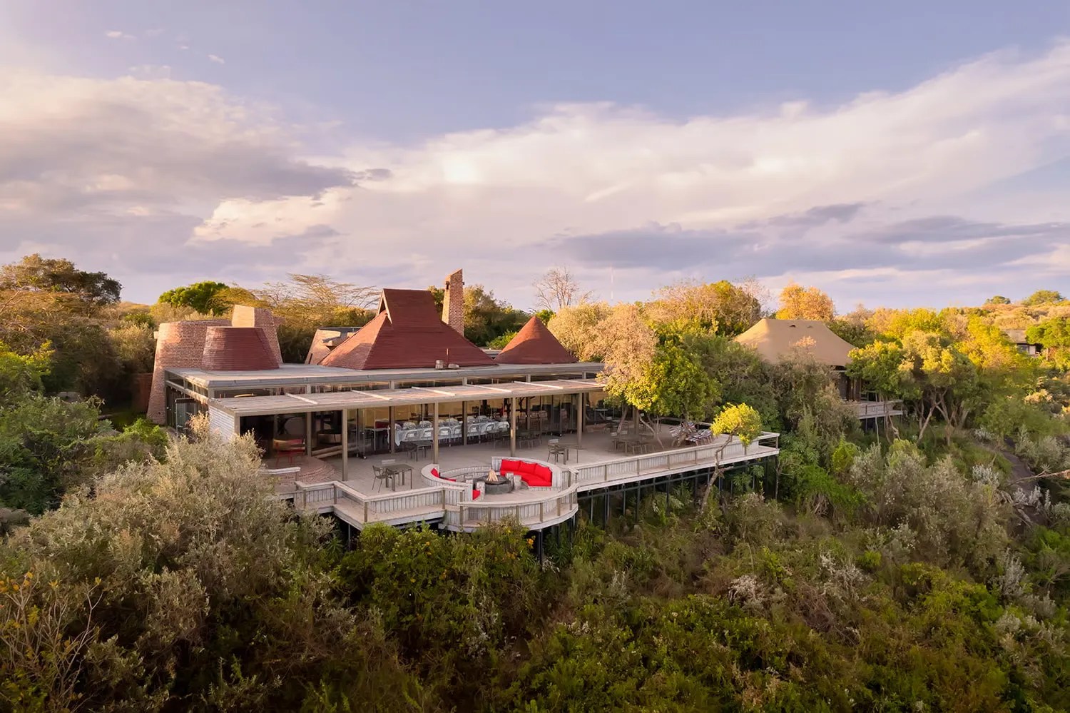 A luxury lodge terrace at golden hour
