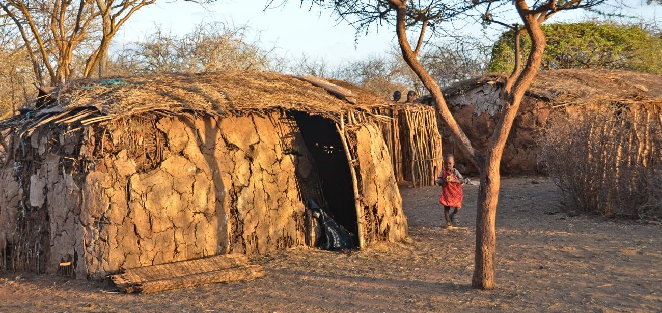 What is a Masai village (enkang) and how it is structured