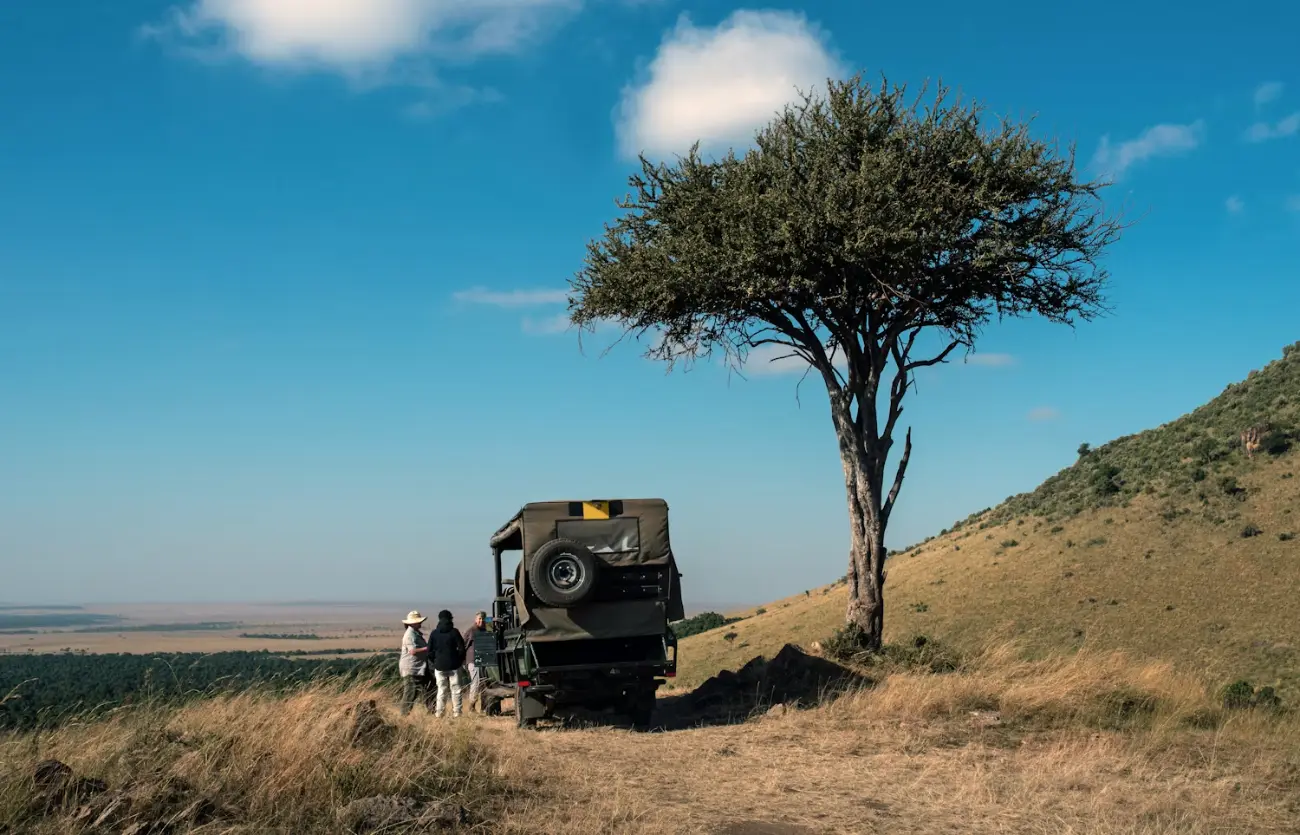 A private safari vehicle in the Masai Mara at golden hour